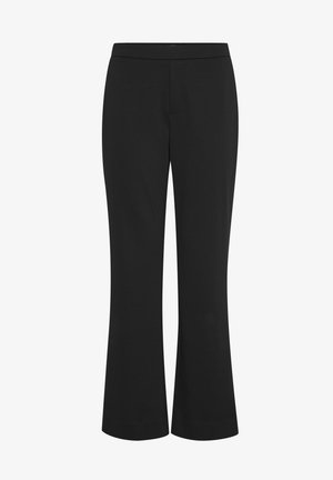 Juodos platėjančios kelnės, pagamintos iš lygios medžiagos. Turi platų juosmenį ir laisvai krentančią konstrukciją, kuri tęsiasi nuo kelių iki apvado.