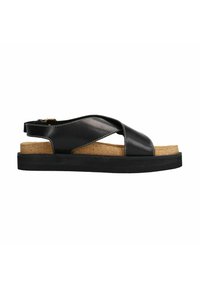 Sandales en cuir noir avec des brides croisées, semelle en liège et semelle en caoutchouc noire. Présente des coutures blanches et une sangle arrière ajustable.