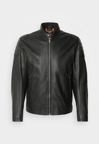 Black leather jacket with a zip closure, stand collar, and shoulder accents. Features textured patches on shoulders and side pockets.