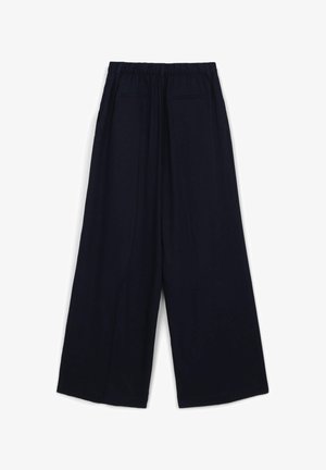 Hose mit weitem Bein in einfarbigem Marineblau mit elastischem Bund, ausgestattet mit zwei Seitentaschen und zwei Gesäßtaschen, gefertigt aus einem glatten Stoff.