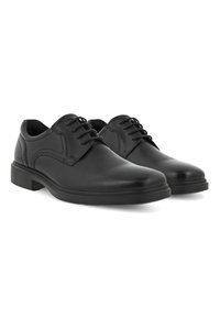 Scarpe da uomo in pelle nera con punta arrotondata, dotate di lacci, con superficie liscia e tacco in gomma basso per stabilità.