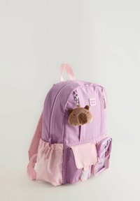 Purple and pink backpack with multiple pockets, a clear front pouch, and a plush bear keychain attached to the zipper.