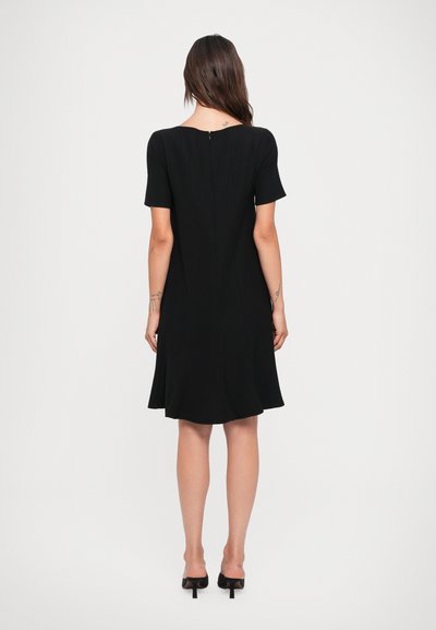 Black short-sleeve dress with a flared skirt, smooth fabric, rounded neckline, and a back zipper detail. Plain design with no patterns.
