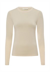 Beige langslipshirt gemaakt van zachte stof met een aansluitend ontwerp en ronde hals. Bevat minimale stiksels en geen zichtbare accenten.