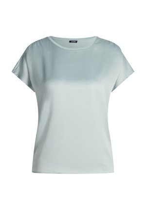 Top a maniche corte azzurro chiaro realizzato in tessuto liscio e morbido con scollatura rotonda. Presenta una vestibilità comoda e dettagli di cuciture minimali.