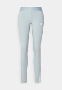 Ljusblå leggings tillverkade av stretchigt material, med hög midja och vita sidsplitter. Inkluderar en liten vit logotyp på framsidan.