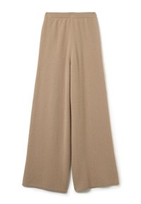 Pantalons en maille larges beige avec taille élastique, longueur complète et tissu doux texturé.