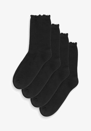 Lot de quatre paires de chaussettes en coton noir, avec un design haut de genou, une texture lisse et un bord ondulé en haut.
