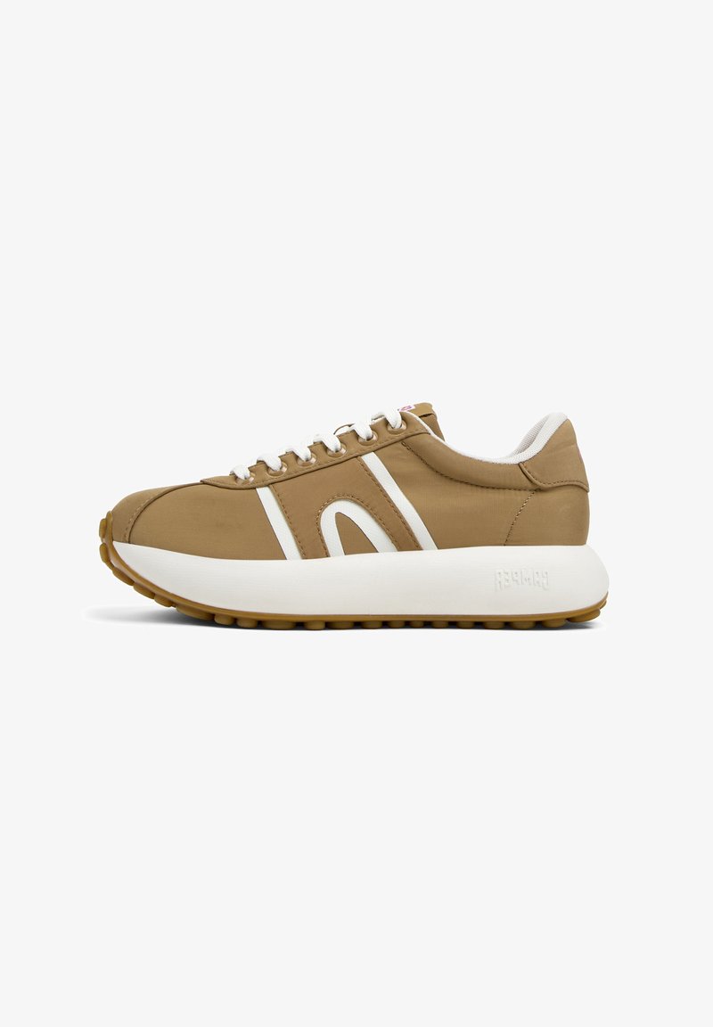 Brown sneaker with white accents, featuring a rounded toe, thick white sole, and textured upper material. Laces and logo detail visible.