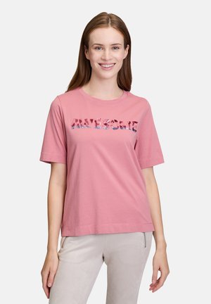 Rosa Baumwoll-T-Shirt mit kurzen Ärmeln, rundem Halsausschnitt und dem Wort "AWESOME", das in Pailletten auf der Vorderseite gedruckt ist. Weicher Stoff, lockere Passform.