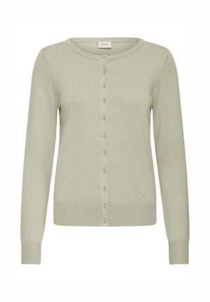 Vaaleanvihreä neuletakki, jossa pitkät hihat, pyöreä pääntie ja napillinen edusta. Valmistettu pehmeästä, hieman teksturoidusta neulemateriaalista.