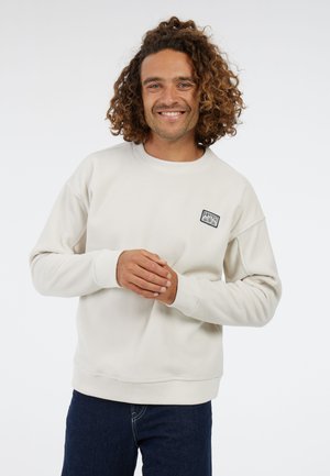 Lichtbeige fleece sweatshirt met ribgebreide manchetten en zoom, voorzien van een klein blauw-wit logo. Katoenmix stof, relaxte pasvorm.