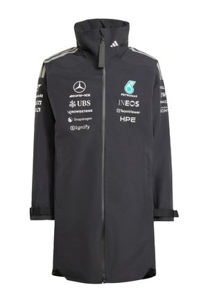 Black long racing team jacket with full front zipper, high collar, and white sponsor logos including Mercedes, Petronas, and INEOS.