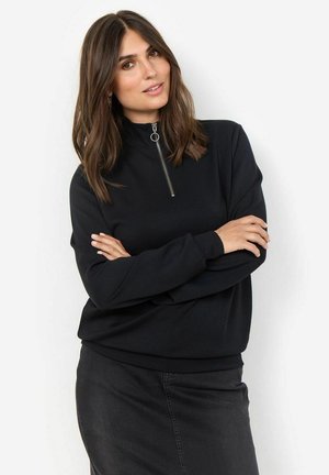 Maglione nero con zip a collo alto, maniche lunghe e vestibilità comoda, realizzato in tessuto morbido. Presenta una zip argentata e polsini a costine.