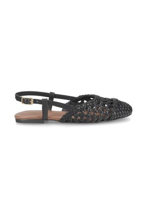Black woven leather pointed toe flat sandal with ankle strap and gold buckle, tan footbed, and flat black sole.