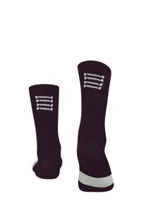 Black knee-length socks with a white striped pattern and logo on the cuffs. Features a contrasting white accent at the heel and toe.