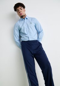 adidas Originals PINTUCK PANT - Treniņtērpa apakšdaļas - night indigo
