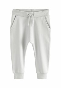 Lichtgrijze joggingsbroek met een ribbelrand bij de taille en boorden, voorzien van een trekkoord en twee zijzakken. Zachte, gladde textuur.