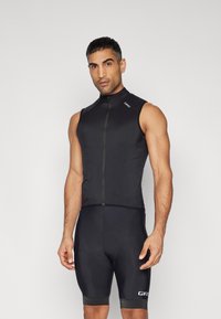 Gilet da ciclismo nero senza maniche con zip frontale, realizzato in materiale leggero. Presenta un design aderente e scollatura arrotondata.