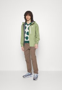 Nike Sportswear Casaco impermeável - alligator sail