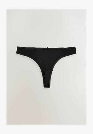 Sorte trusse i blød stof med et gennemsigtigt panel, der har blonder langs taljen og en lille sløjfedetalje foran.