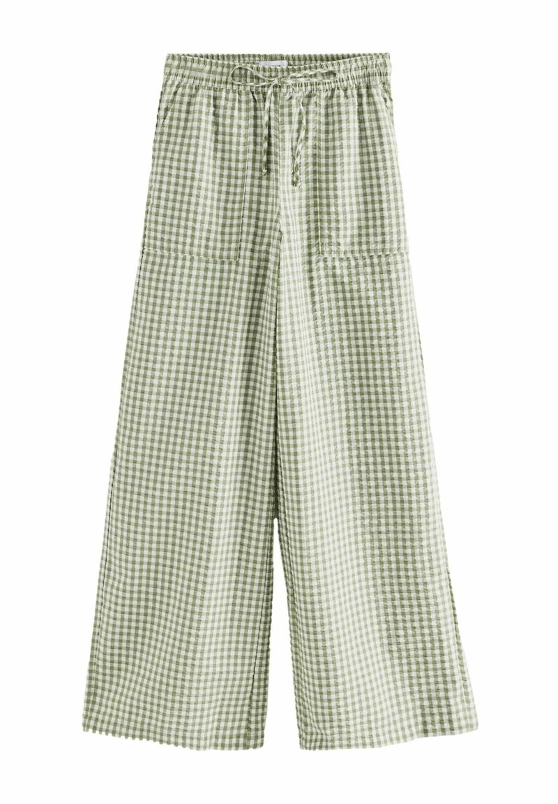 Pantalon large à carreaux verts et blancs avec taille élastique et cordon à l'avant, doté de deux grandes poches plaquées sur le devant.
