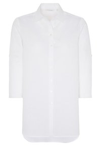 Camicia bianca con collo alla coreana, maniche a tre quarti e orlo dritto. Realizzata in tessuto leggero con una sottile trama.