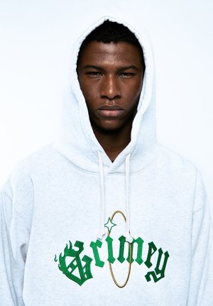 Gray hoodie with a drawstring hood, featuring green embroidered text and accents. The fabric appears soft with a smooth texture.