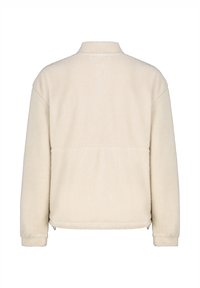Fleece-Jacke in Cremefarbe mit hohem Kragen, strukturierter Stoff und geradem Saum. Verfügt über lange Ärmel und seitliche Taschen.
