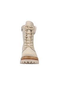 Botte en cuir beige à lacets avec fermeture éclair sur le côté, semelle texturée et accent en fourrure au niveau du bord. Conçue pour la durabilité et le confort.