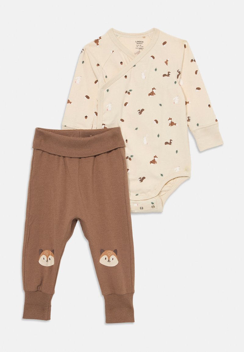 Beige long-sleeve baby bodysuit with woodland animal prints paired with brown pants featuring fox faces on the knees.
