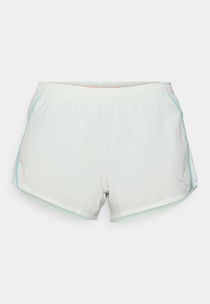 Light green running shorts with an elastic waistband, side seam pockets, and contrasting blue stitching. Features a small logo on the thigh.