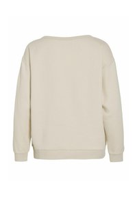 Sudadera de color beige claro con un corte relajado, cuello redondo y puños acanalados. Textura suave y diseño minimalista sin patrones visibles.