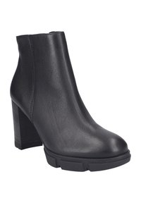 Stivaletto in pelle nera con tacco blocco chunky e suola testurizzata, punta arrotondata liscia e chiusura con zip laterale.