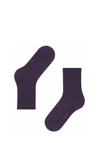 Chaussettes de cheville violettes avec un motif en chevrons, bord-côte et logo rose contrastant. Fabriquées en matériau doux et extensible.