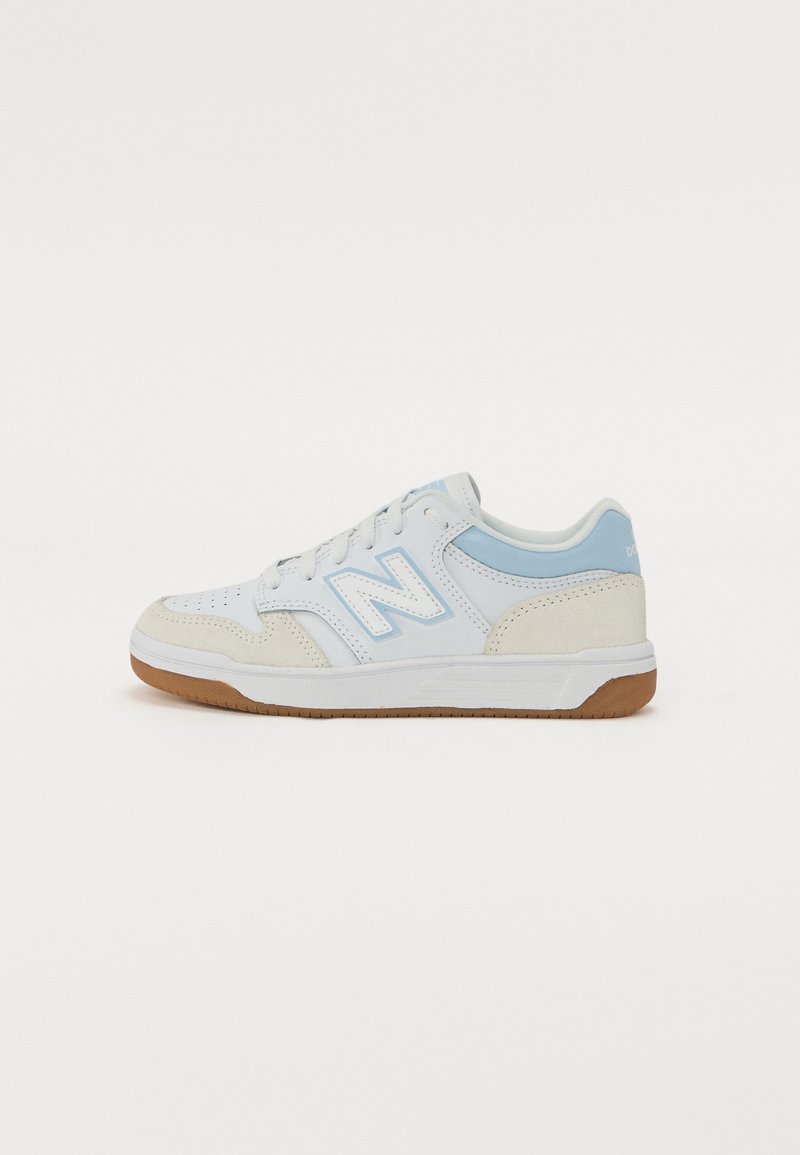 White and light blue sneakers with perforated leather, suede accents, and a gum rubber sole; features a prominent 'N' logo on the side.