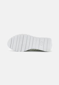 White rubber shoe sole with textured grooves and embossed patterns. Features firm traction ridges and a rounded toe design.