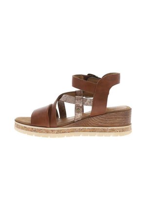 Sandale compensée en cuir marron avec bride à la cheville et brides croisées en tissu texturé, semelle effet liège et semelle intérieure rembourrée.