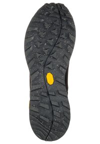 Suola di scarpa in gomma nera con scanalature profonde triangolari e lineari, con un piccolo logo esagonale giallo Vibram vicino al centro.