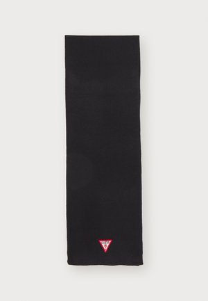 Écharpe en tricot noire avec un petit logo triangulaire rouge portant le texte "GUESS" à une extrémité. Texture lisse avec une forme rectangulaire.