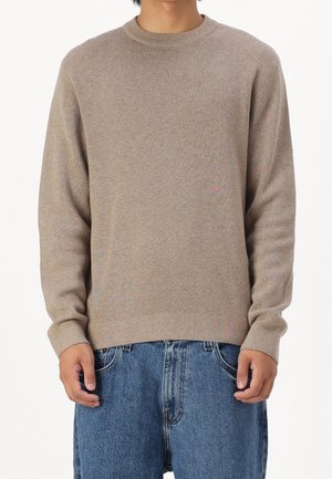 Stickad tröja - beige