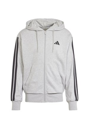 Grijze zip-up hoodie van zachte stof, met zwarte zijstrepen, kangoeroezakken en een capuchon met trekkoord. Adidas-logo op de borst.