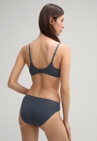Gray patterned bikini set featuring a textured design, adjustable straps, and a hook closure. Back view showcases seamless coverage.