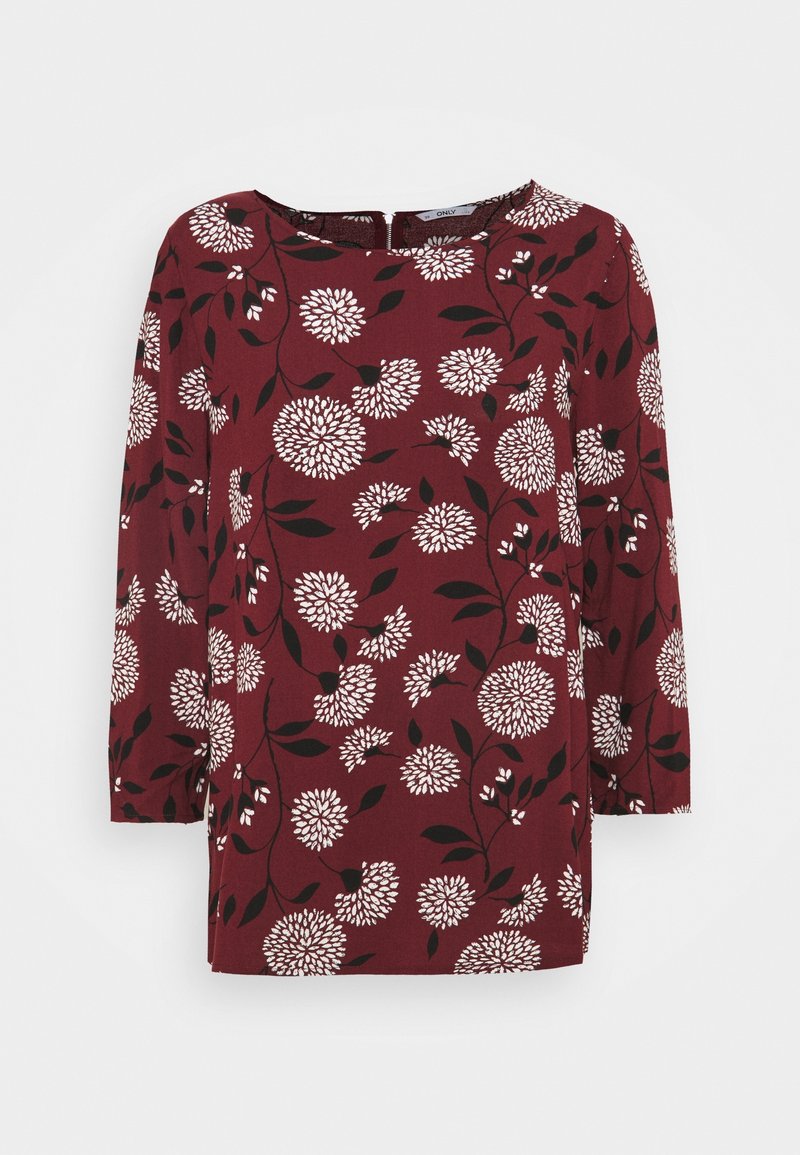 Blusa bordeaux con motivo floreale bianco e nero, maniche a tre quarti, scollatura rotonda e vestibilità rilassata.