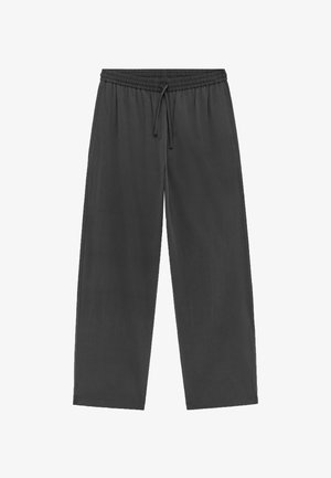 Pantalon à taille élastique en tissu gris foncé, équipé d'un cordon de serrage, coupe ample, jambes droites et texture lisse. Sans motifs ni éléments métalliques visibles.