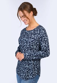 Marineblaue Langarmbluse mit floralem Druck in Hellblau, runder Ausschnitt, lockere Passform und abgerundetem Saum. Das Material erscheint weich und strukturiert.