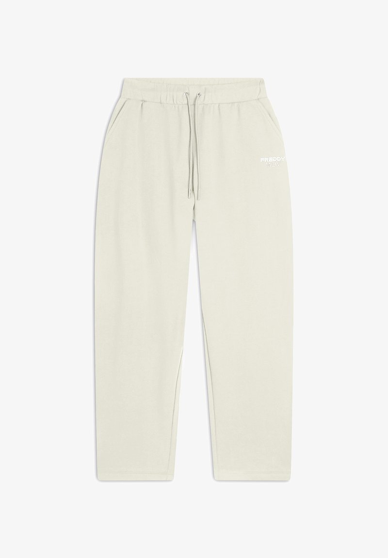 Ljusbeiga sweatpants i mjukt tyg, med dragsko i midjan, sidofickor och en liten vit logotyp framtill.