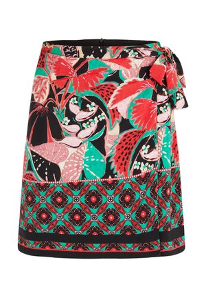 Floral wrap skirt in vibrant red, green, and black with a tie at the waist. Features bold patterns and textured fabric.
