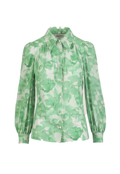 Garām piedurknēm ar pogām aiztaisāma blūze ar uzpampušām plecu daļām, zaļš ziedu raksts uz caurspīdīgas baltas auduma, ar smailu apkakli.