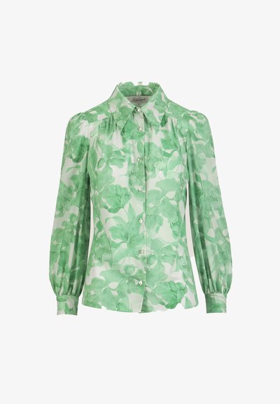 Garām piedurknēm ar pogām aiztaisāma blūze ar uzpampušām plecu daļām, zaļš ziedu raksts uz caurspīdīgas baltas auduma, ar smailu apkakli.